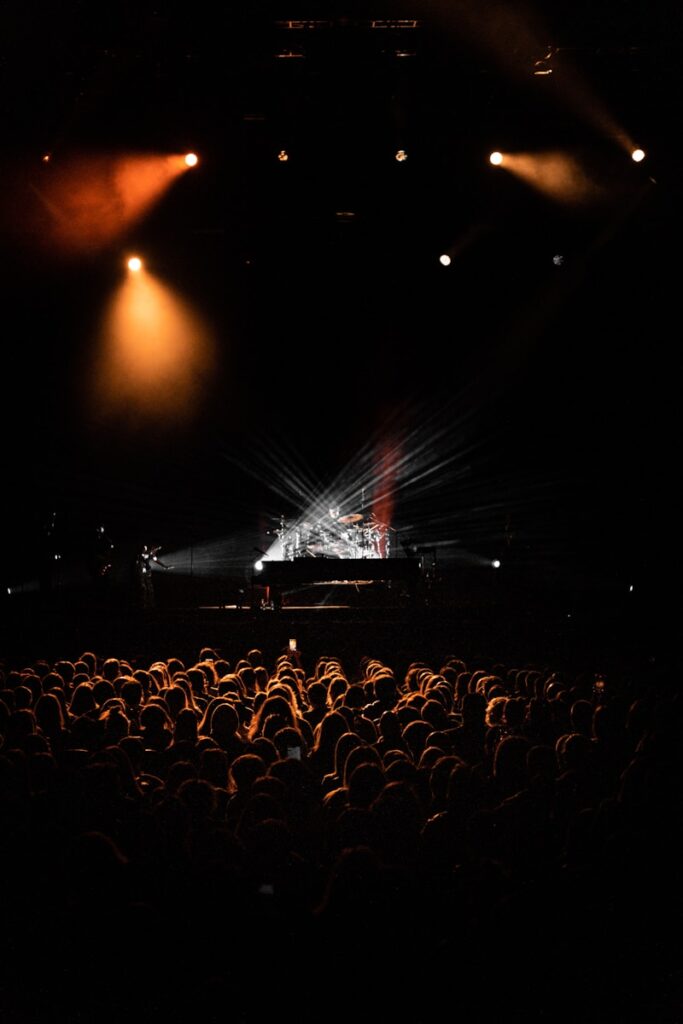 a crowd of people standing on top of a stage