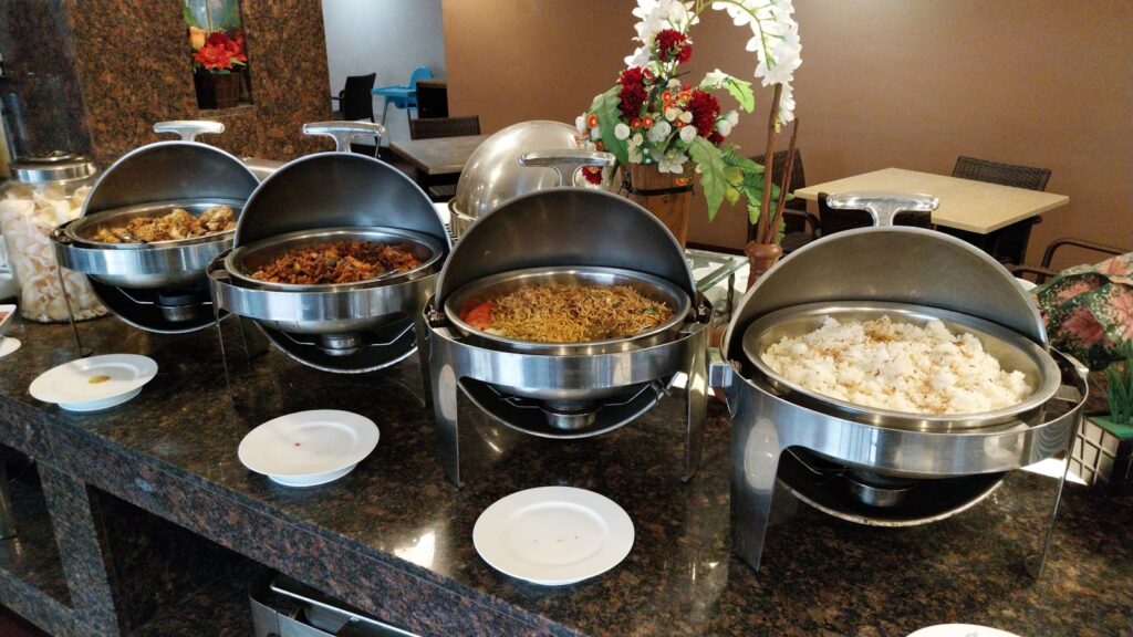 A buffet with many different types of food on it